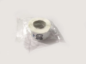 Detail view of cartoon Halloween ghost sticker roll in transparent plastic packaging