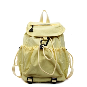 Minimalist light yellow drawstring backpack made of lightweight nylon with buckle closure