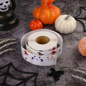 Halloween cartoon ghost and pumpkin sticker roll with festive decorations on grey stone background