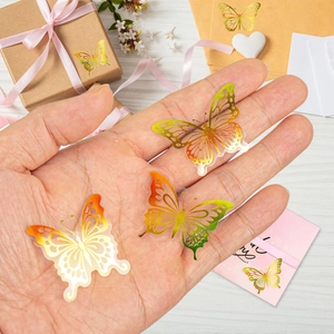 Macro shot of 3D gradient butterfly stickers for gift boxes and envelope seals