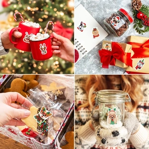Detailed view of Christmas dog stickers applied on water bottles and gift boxes