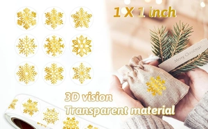Detailed macro of 1-inch transparent gold foil snowflake stickers on a rustic burlap gift bag