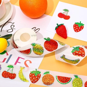 Roll of glittery summer fruit stickers featuring lemon and strawberry for DIY crafts