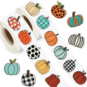 Roll of assorted autumn pumpkin stickers with plaid and polka dot patterns for fall decor