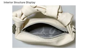 Interior structure display of cloud bag showing silver zipper and herringbone lining