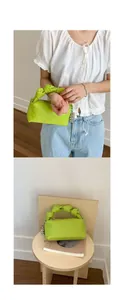 Detail of lime green cloud bag featuring knotted handle and silver metallic ball charm