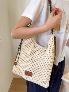 Beige hand-woven crochet tote bag with wooden bead straps and inner lining for summer