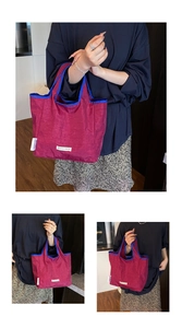Detail view of casual women's tote bag, stylish contrast color folding shopping bag.