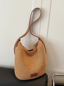 Large woven hobo bag with brown leather straps for summer beach vacation and daily use