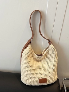 Large capacity knit bucket bag in cream with adjustable brown leather shoulder strap