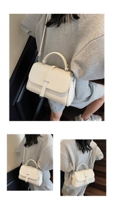 Detail view of white lychee pattern leather crossbody bag with silver buckle and shoulder strap