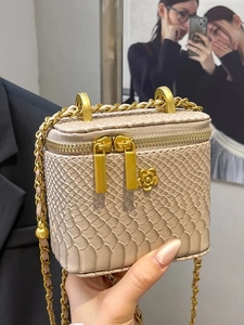 Mini beige snake skin square vanity bag with gold camellia charms and chain strap