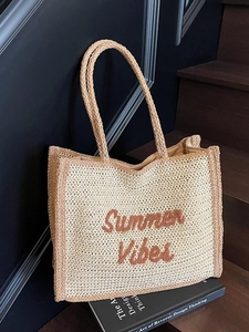 Beige woven straw tote bag with Summer Vibes embroidery and brown shoulder handles