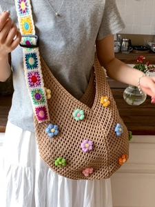 Bohemian crochet hobo beach bag with colorful floral knit patterns and shoulder strap