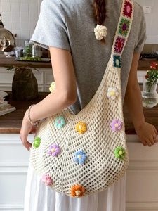 Handmade crochet hobo bag with 3D colorful floral patterns for summer beach vacation