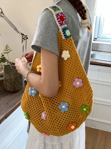 Handmade yellow crochet beach tote bag with colorful 3D flower appliques and wide straps
