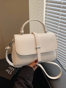 White lychee pattern leather handbag with silver buckle and detachable shoulder strap