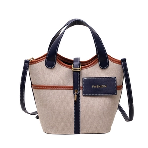 Borsa a secchiello moderna in tela e pelle blu con manico e tracolla lunga