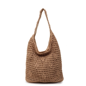 Minimalist khaki woven straw tote bag with large hollow crochet pattern and fabric lining