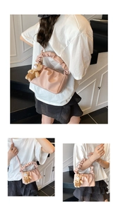 Detailed views of a pink pleated cloud bag with frill handle and cute bear charm pendant