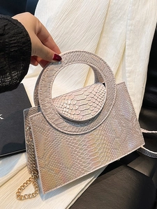 Elegant pearlescent white faux-crocodile handbag with round handle and gold chain strap