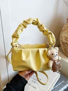 Yellow pleated cloud handbag with cute bear charm and adjustable crossbody strap
