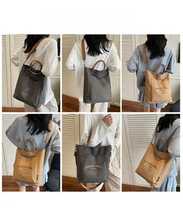 Detail showing versatile canvas tote bag styled as a shoulder and crossbody bag for women