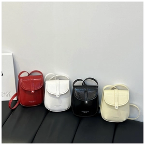 Detailed row of small crossbody phone bags in red, white, black, and beige leather