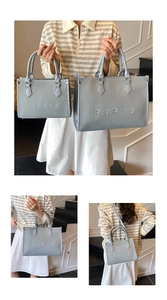 Detailed set of light blue canvas tote bags with white Paris embroidery and shoulder straps