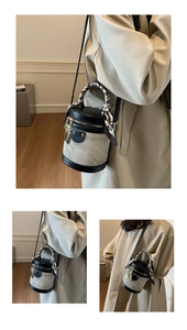 Detail of contrast bucket bag with wrapped scarf handle and canvas leather panels