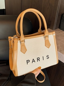 Elegante borsa tote in tela beige con finiture in pelle marrone e stampa Paris nera