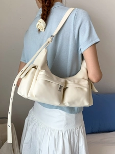 Chic beige multi-pocket PU leather tote bag with silver rivet studs on shoulder strap