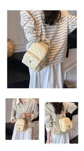 Detail der beigen gesteppten Eimer-Tasche mit Metalldrehverschluss und Kettenriemen
