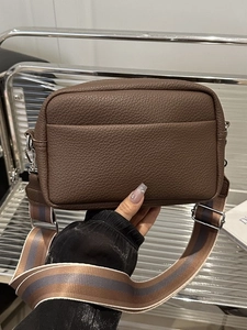 Brown litchi grain camera bag with adjustable colorful striped fabric shoulder strap