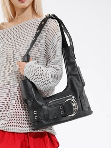 Retro black biker shoulder bag with silver buckles and large capacity worn by model