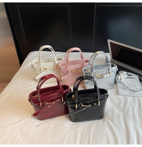 Collection of mini tote bags in five colors with metal buckles and textured PU leather