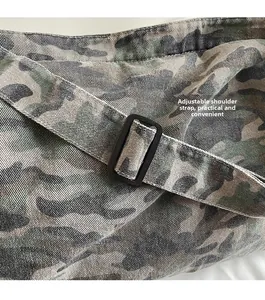 Detail of adjustable shoulder strap with buckle on leopard print canvas tote bag