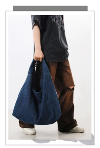 Side view of large capacity washed denim tote bag showing its texture and spacious design