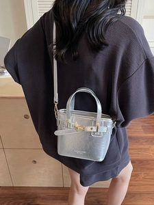 Silver metallic leather handbag with vintage buckle and round handles for women