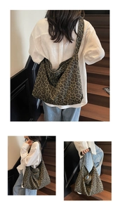 Detail view of large leopard print canvas hobo bag showing wide strap and semi-moon design