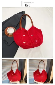 Detail of red woven tote bag with embroidered bows and brown leather handles