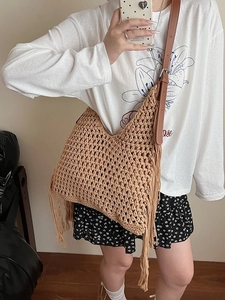 Handwoven hollow wax rope tote bag with tassels and adjustable leather straps for beach vacation