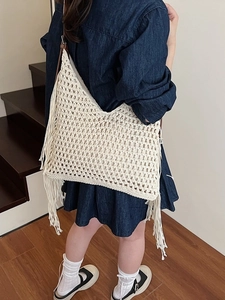 Cream handmade crochet tote bag with long side tassels and bohemian woven details