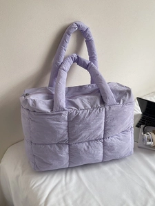 Quilted lavender tote bag with soft padded handles and large capacity for casual commuting