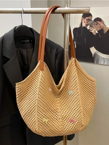 Handwoven beige crochet tote bag with colorful butterfly bows and brown leather straps