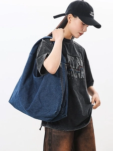 Minimalist navy blue denim tote bag shoulder carry style shown on model with large capacity