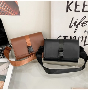 Detail of dark brown and black minimalist box bags with nylon straps and plastic buckles