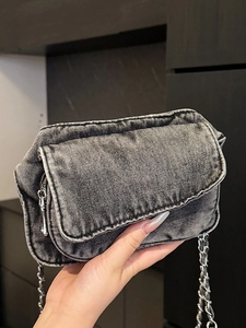 Vintage acid wash denim crossbody bag with silver metal chain strap and flap closure