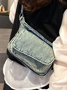Retro washed denim crossbody bag for women with flap closure and silver chain strap