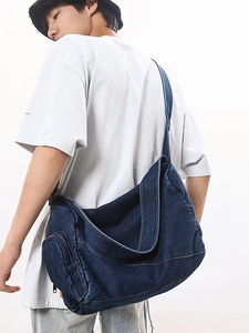 Deep blue washed denim messenger bag for women featuring a spacious retro crossbody design